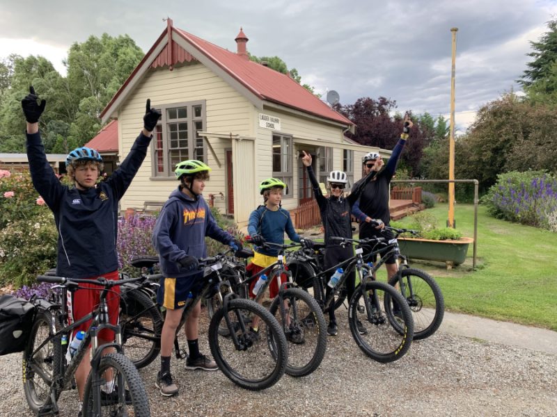 Happy family group leaving Lauder School accommodation